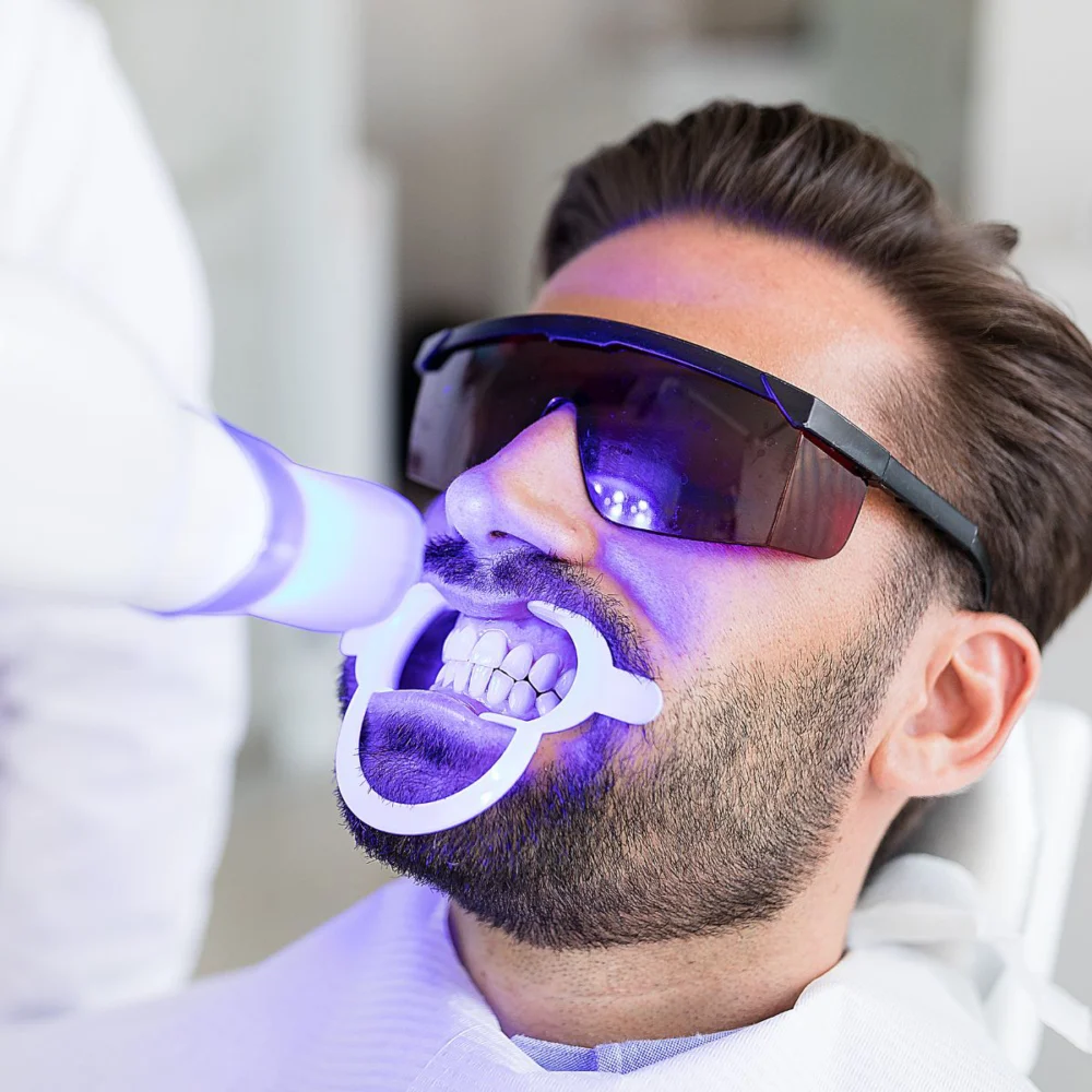 Patient Getting Professional Teeth Whitening Service