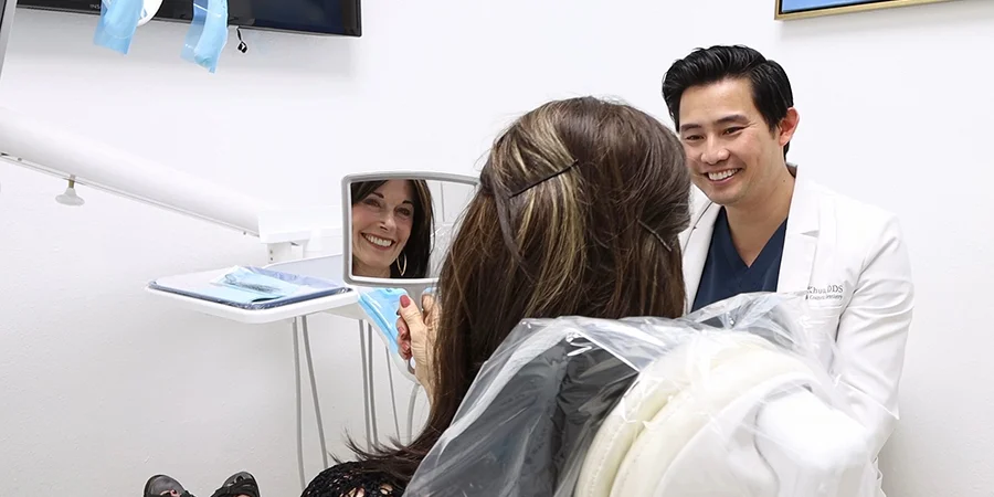 Dr. Tan Khuu Smiling With Dental Patient